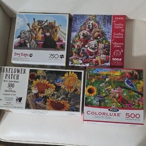 4  Puzzle Lot - Dog Days 750,
Caroling Critters 500, Sunflower Patch 300 & Sunfl